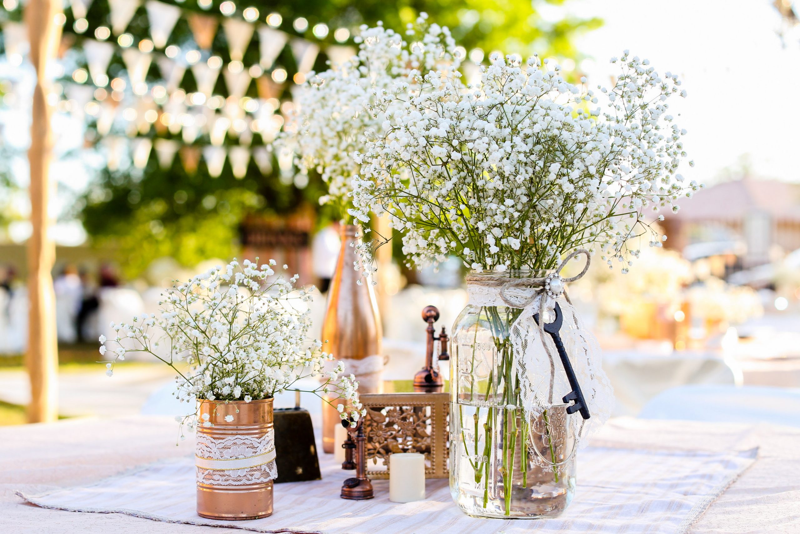 bunch of baby's breath flowers in a mason jar table decor