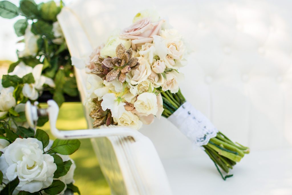 a beautiful bouquet of white roses and succulents