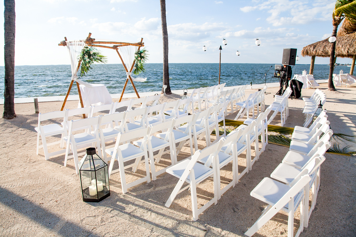 A beautifully decorated altar in an outdoor beach themed wedding ceremony